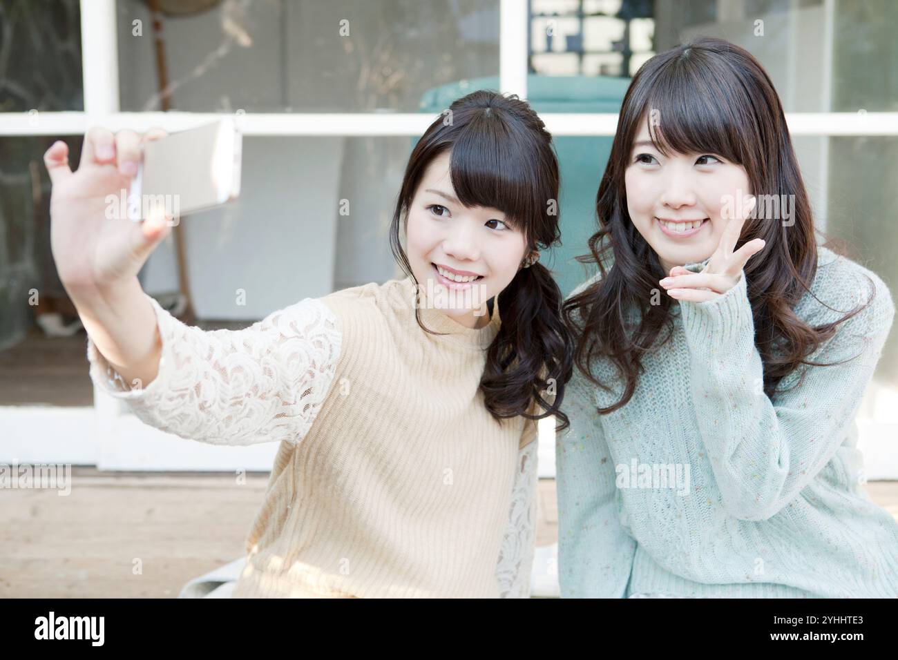 Two japanese women pose in hi-res stock photography and images - Alamy