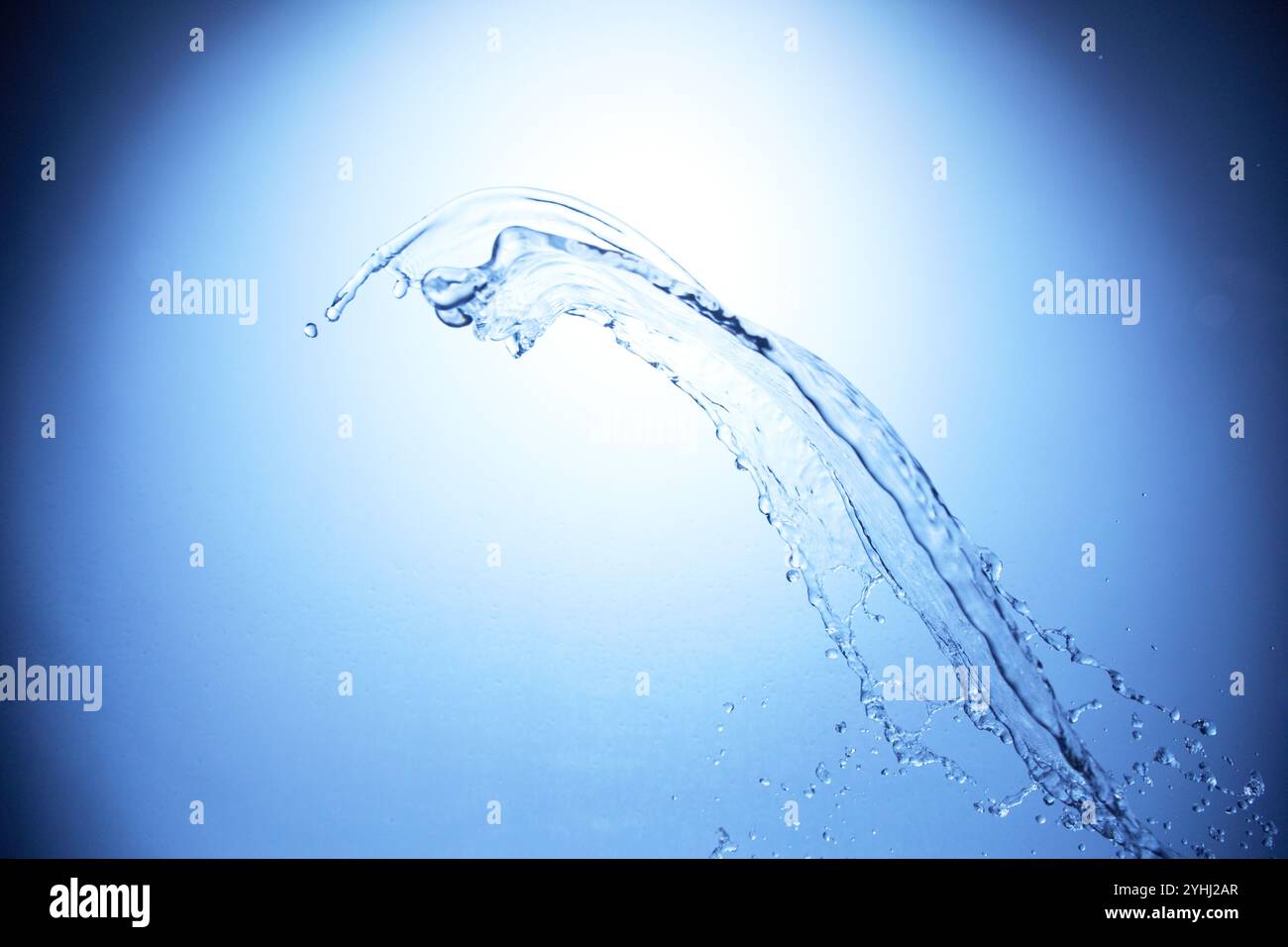 Water splashing on blue background hi-res stock photography and images ...