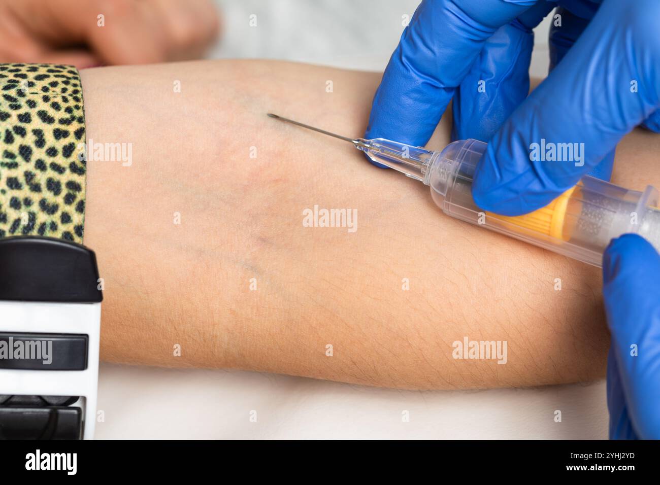 Close-up shot of healthcare worker wearing gloves ready to take a blood ...