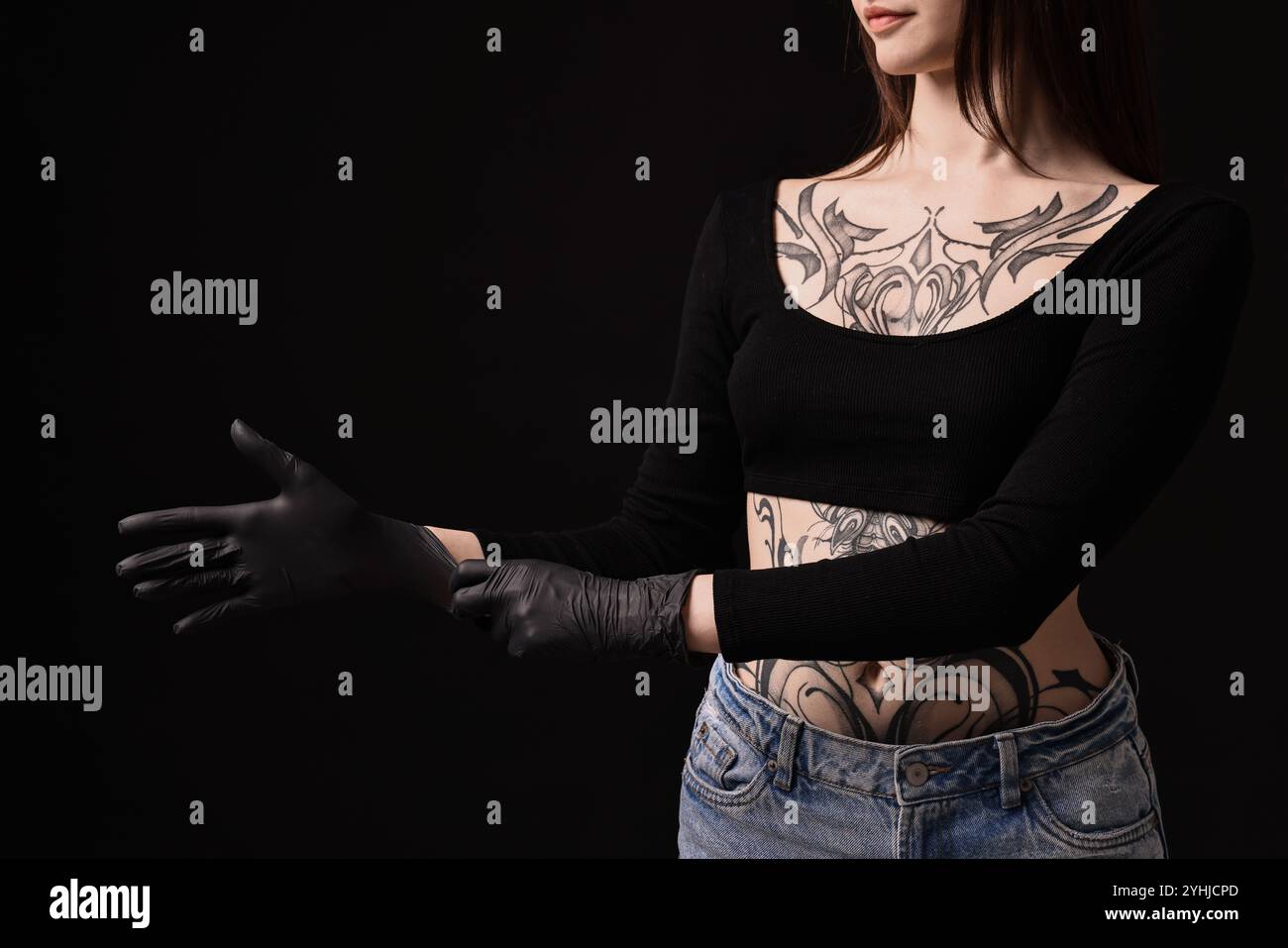 Professional tattoo artist wearing black hi-res stock photography and ...