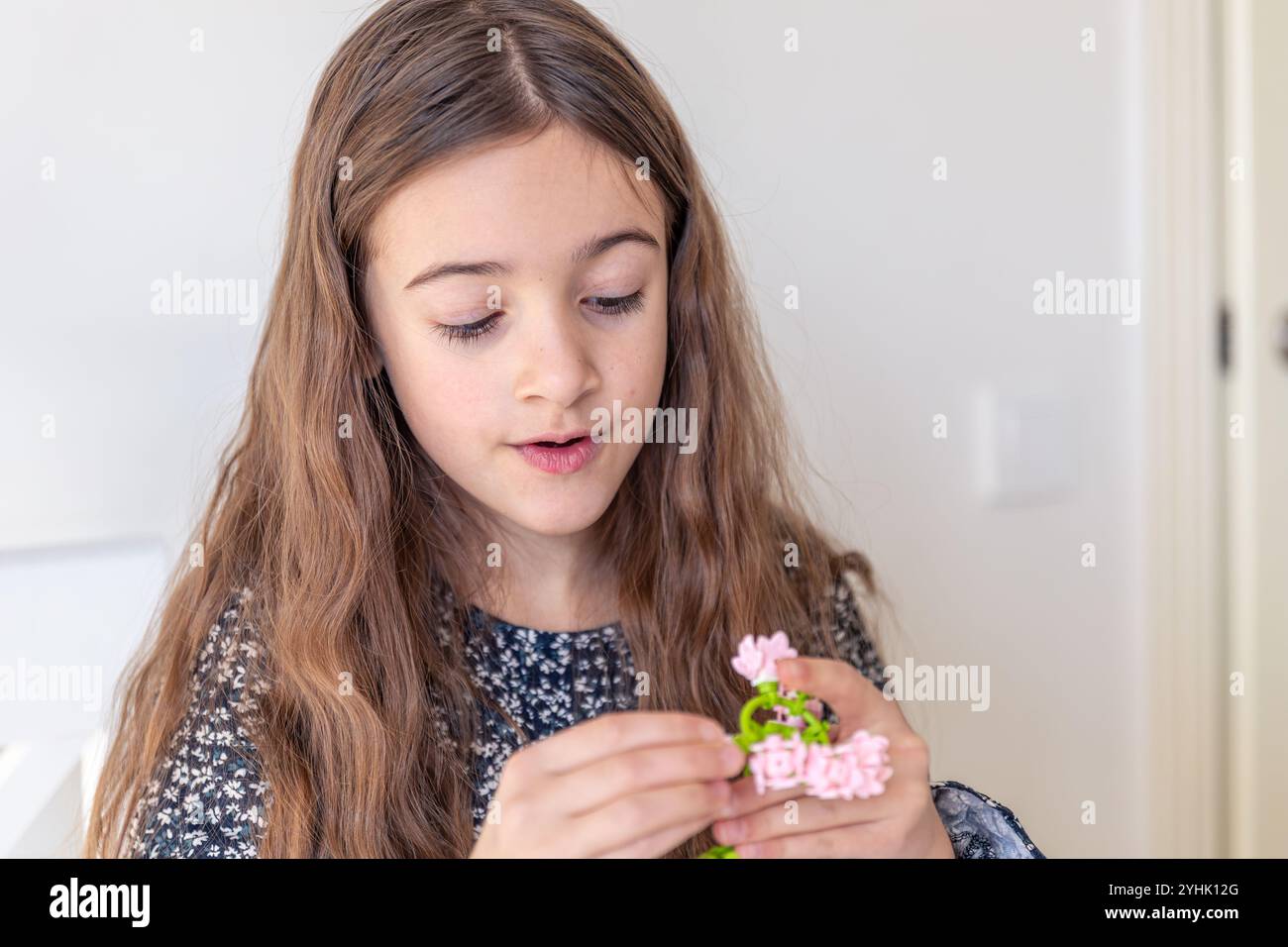 The girl is playing constructor. Early development Stock Photo - Alamy