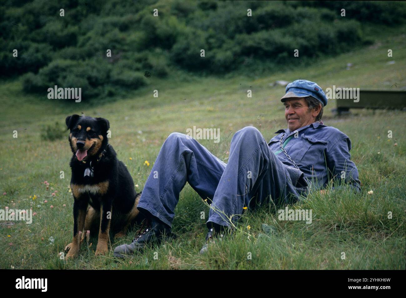 Alp Farmer with Bernese Mountain Dog Stock Photo