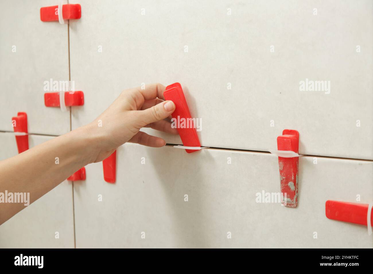 Tiles bathroom laying woman hi-res stock photography and images - Alamy