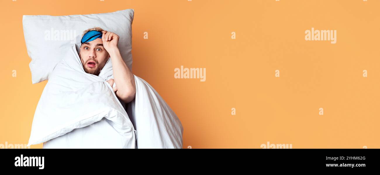 Funny guy woke up on yellow background Stock Photo