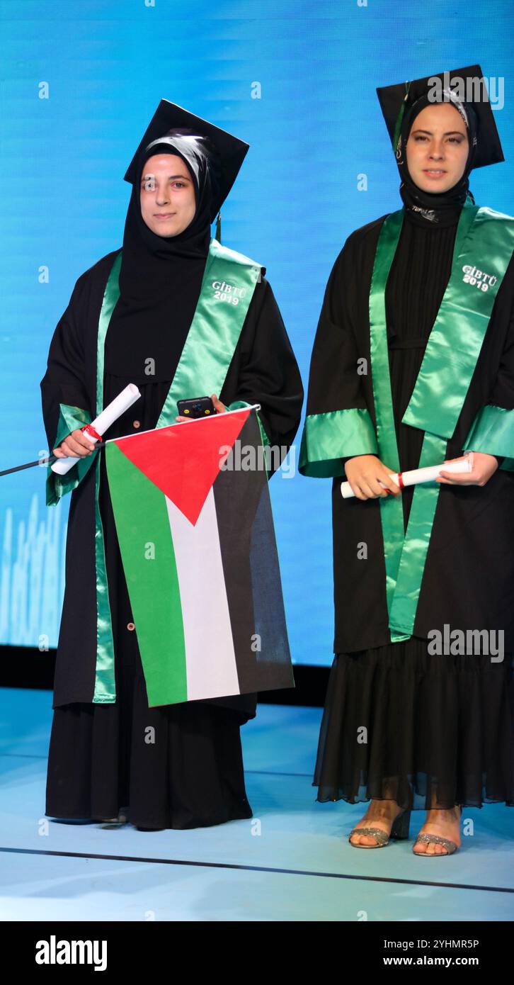 Gaziantep, Turkiye. 24 May 2024. Students from different faculties attend their graduation ceremony at the Gaziantep University of Islamic Science and Technology (GIBTU). During the ceremony, a number of students wore the Palestinian kufiyah and raised the Palestinian flag in solidarity with Gaza and Palestine Stock Photo