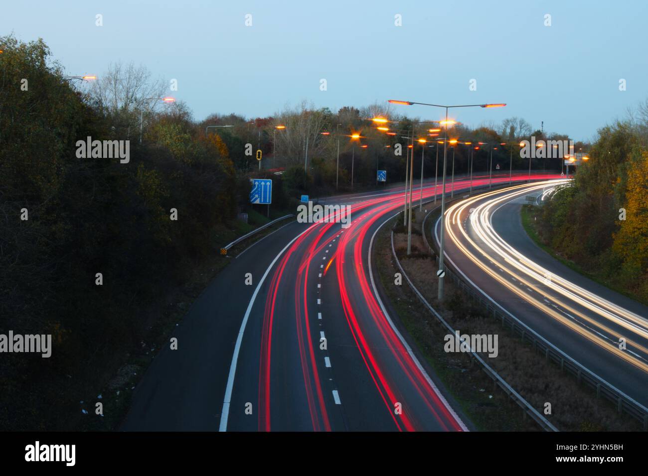 Rows of Warm Deep Red Glow of SOX Street Lights Warming Up On A Winter Evening In Hertfordshire Stock Photo