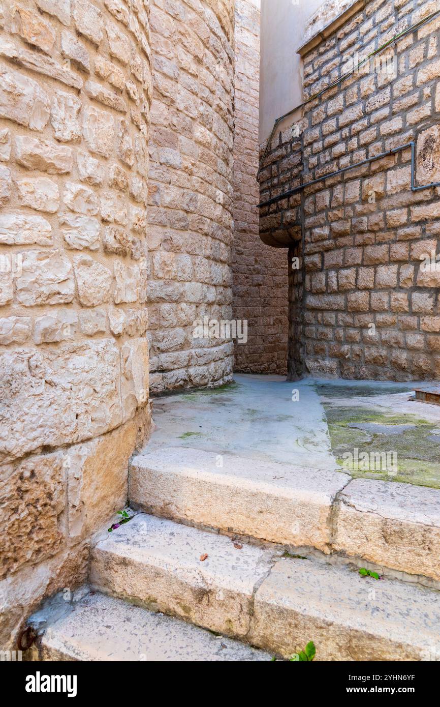 Narrow Alley in the Jewish Quarter of Trani, Italy Stock Photo