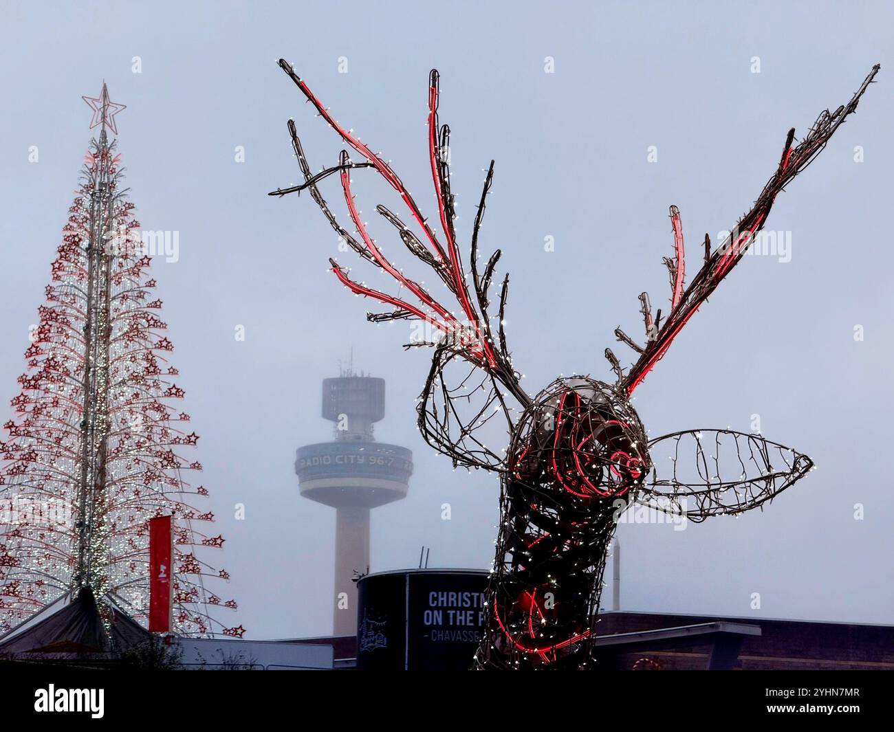 St Johns Beacon (Radio City tower) in distance with Christmas tree and reindeer structure in Liverpool (Liverpool One) shopping Centre - Smartphone Captured Stock Image