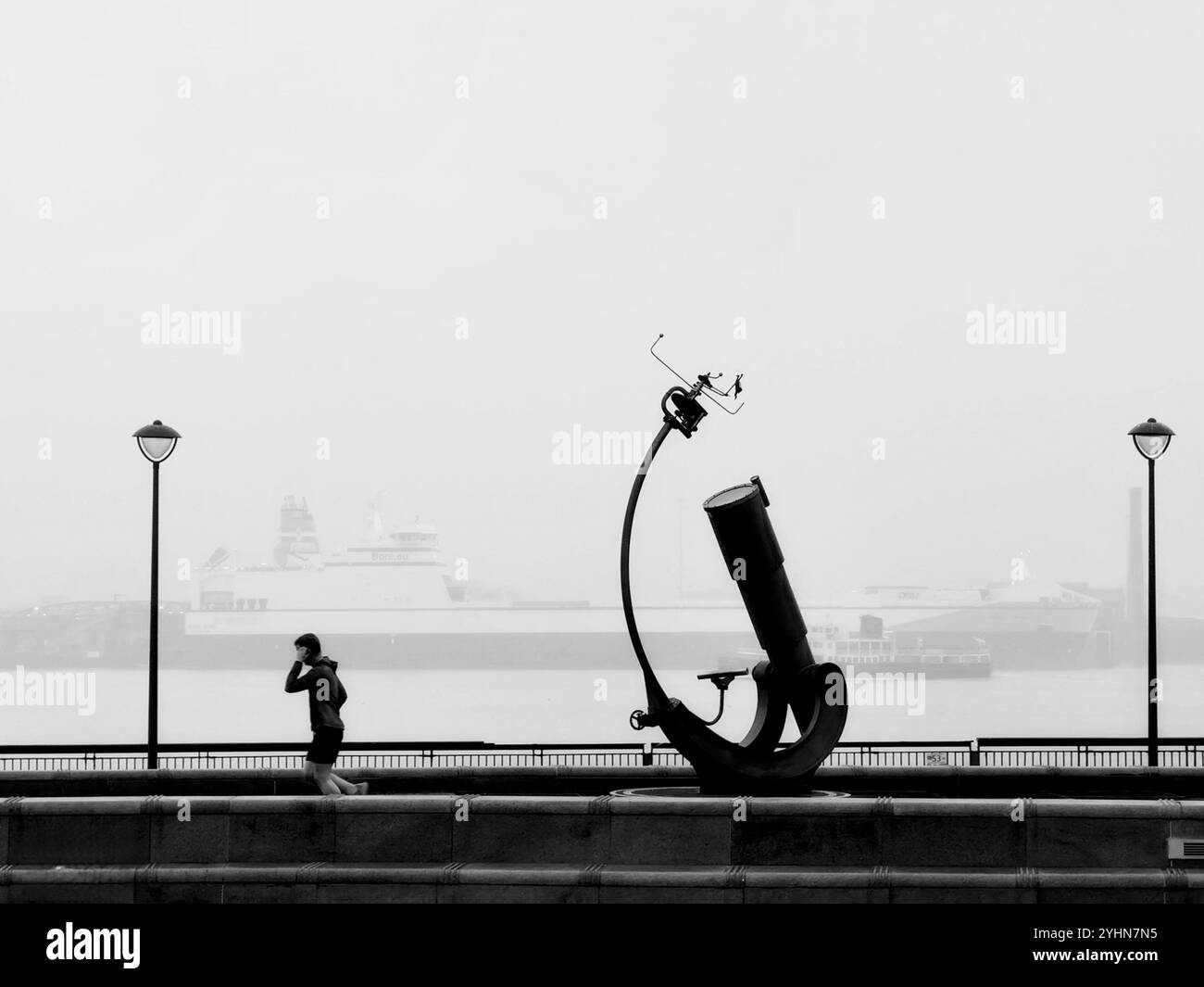 Heaven and Earth Telescope and Orrery sculpture in the mist at the Pier Head, Liverpool - Smartphone Captured Stock Image