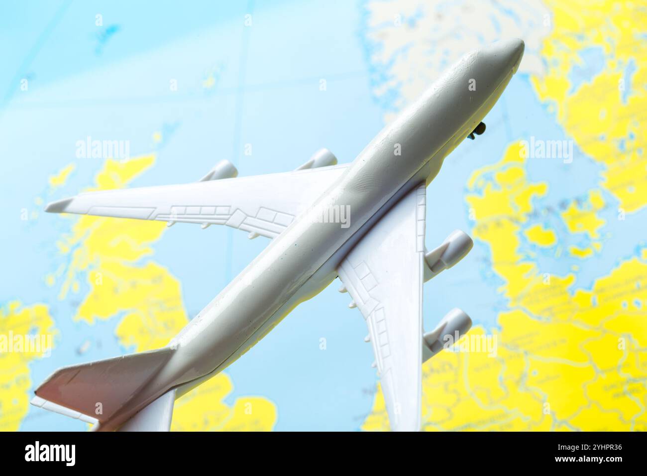 Model Aircraft Map miniature of a passenger aircraft flying on a map Stock Photo - Alamy