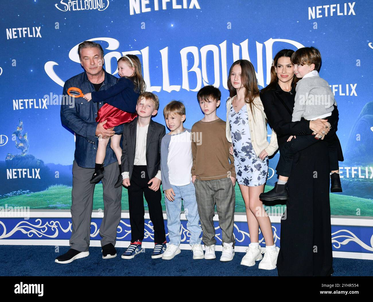 Alec Baldwin, left, and wife Hilaria Baldwin pose with their children
