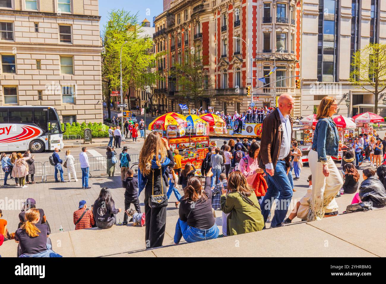 People near colorful food carts on busy New York City street with ...