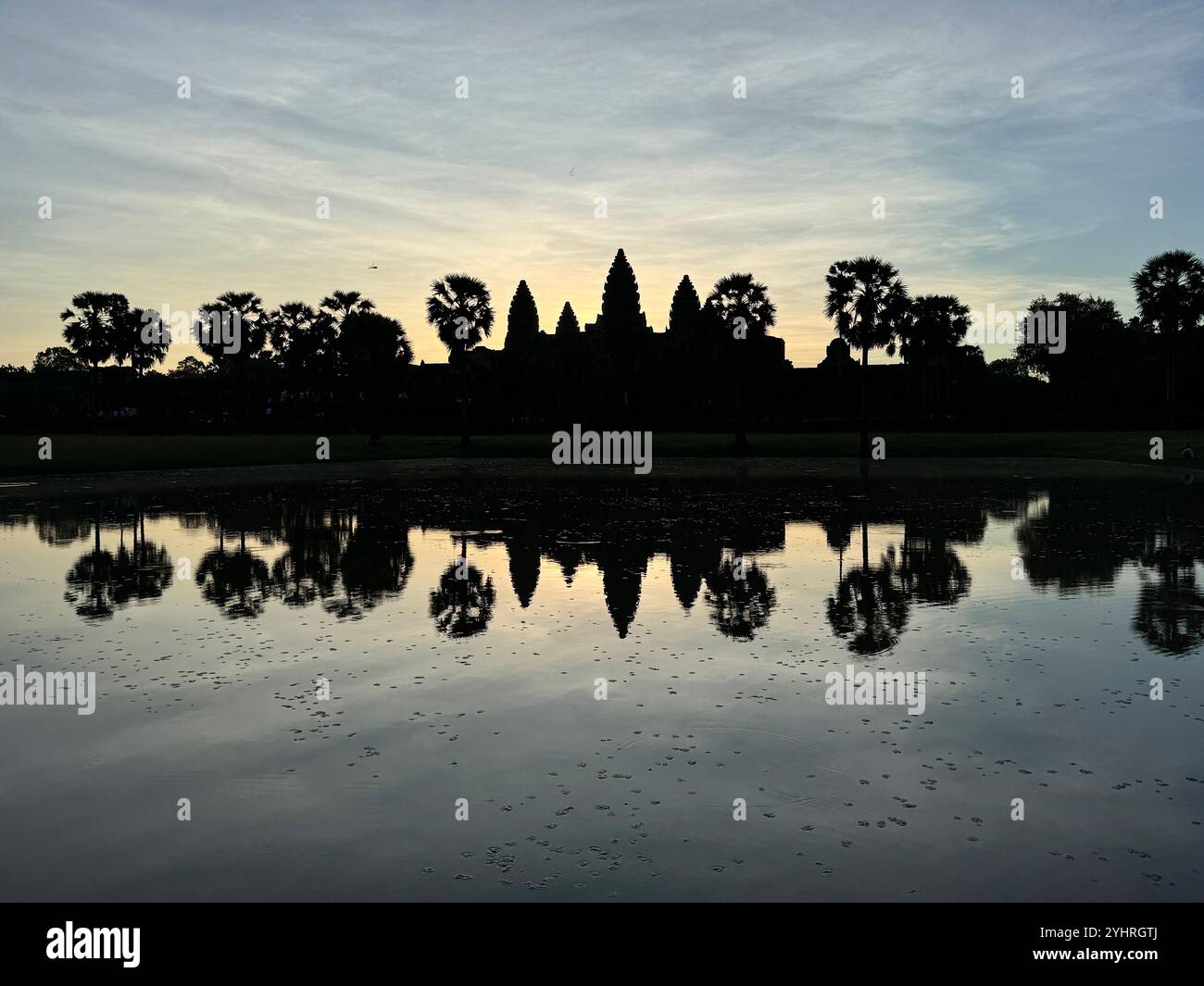 Sunrise at Angkor Wat  - a hindu & buddhist temple , located within the ancient Khmer capital city , Unesco world heritage site, Siem Reap , Cambodia - Smartphone Captured Stock Image