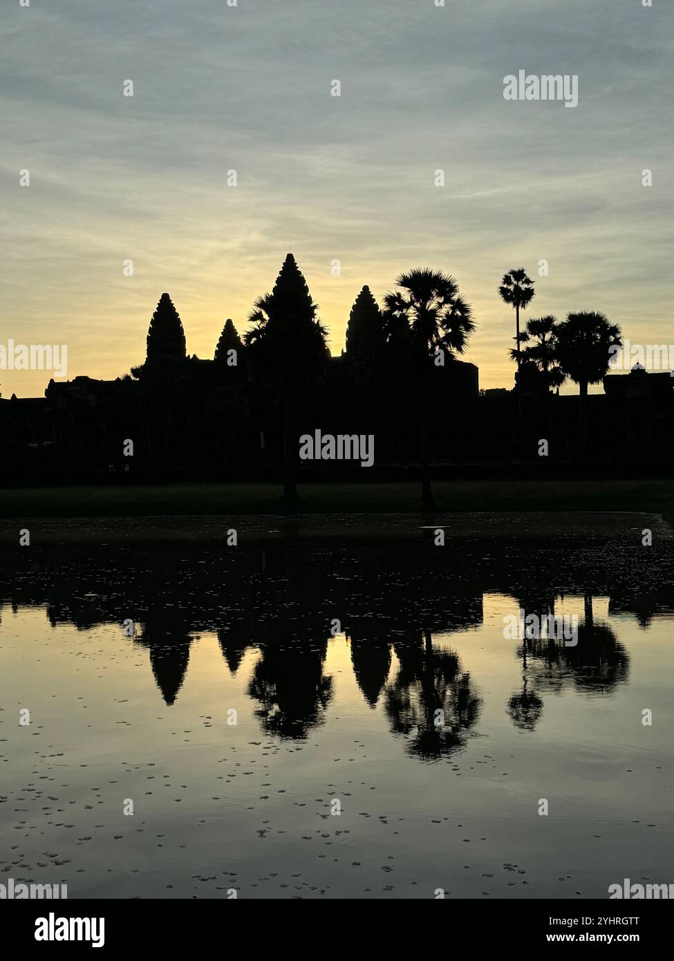 Sunrise at Angkor Wat  - a hindu & buddhist temple , located within the ancient Khmer capital city , Unesco world heritage site, Siem Reap , Cambodia - Smartphone Captured Stock Image