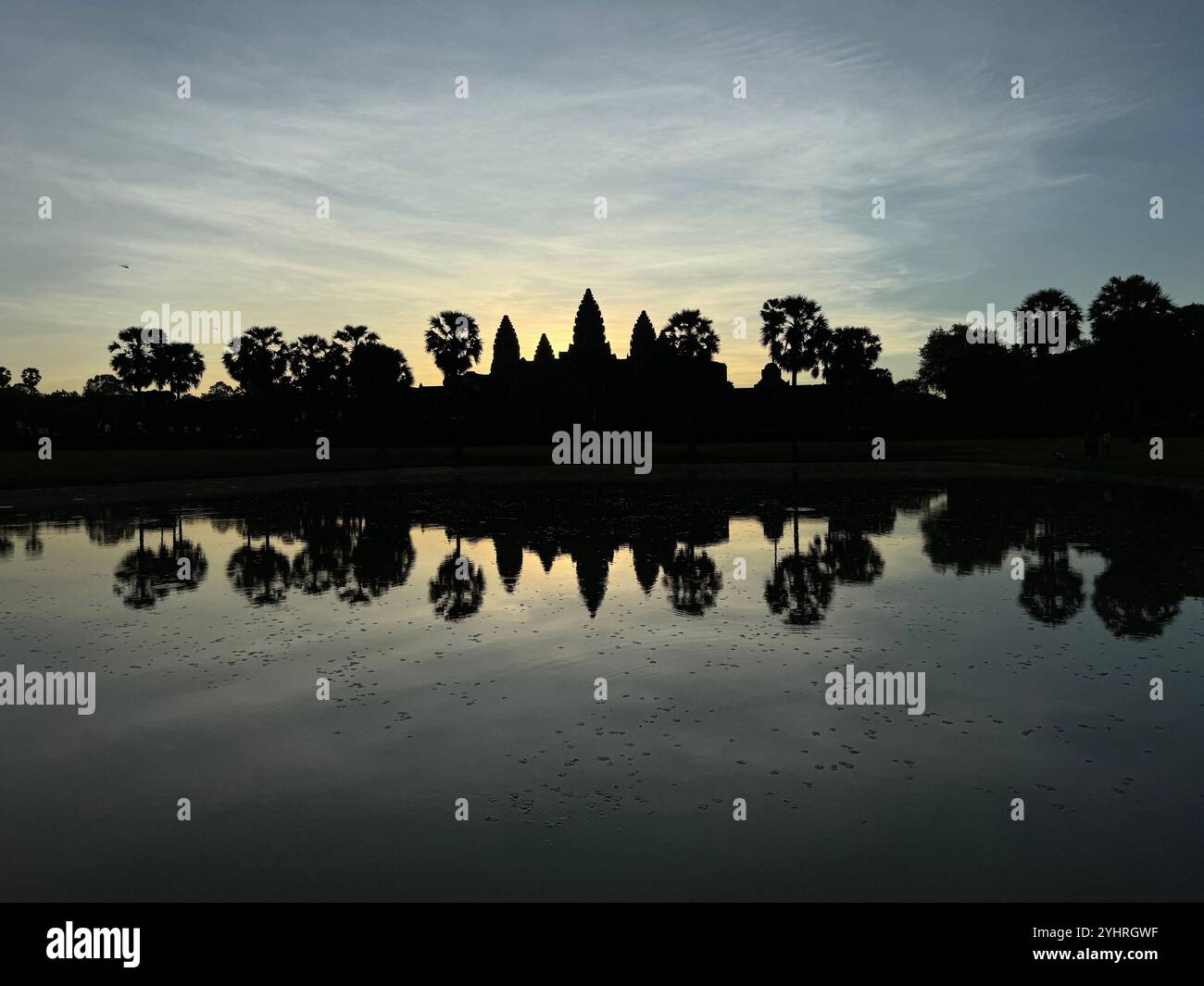 Sunrise at Angkor Wat  - a hindu & buddhist temple , located within the ancient Khmer capital city , Unesco world heritage site, Siem Reap , Cambodia - Smartphone Captured Stock Image