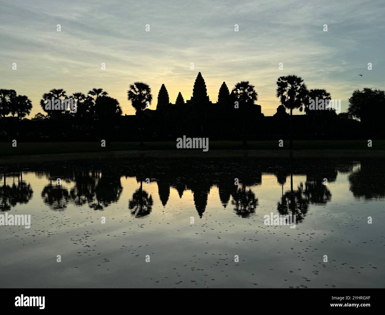 Sunrise at Angkor Wat  - a hindu & buddhist temple , located within the ancient Khmer capital city , Unesco world heritage site, Siem Reap , Cambodia - Smartphone Captured Stock Image