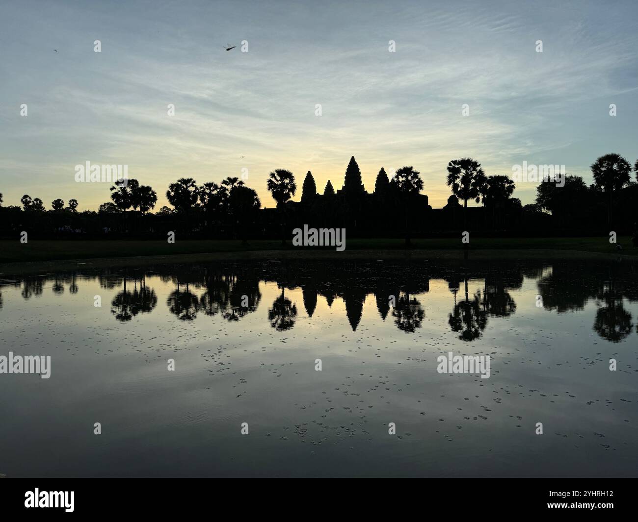 Sunrise at Angkor Wat  - a hindu & buddhist temple , located within the ancient Khmer capital city , Unesco world heritage site, Siem Reap , Cambodia - Smartphone Captured Stock Image
