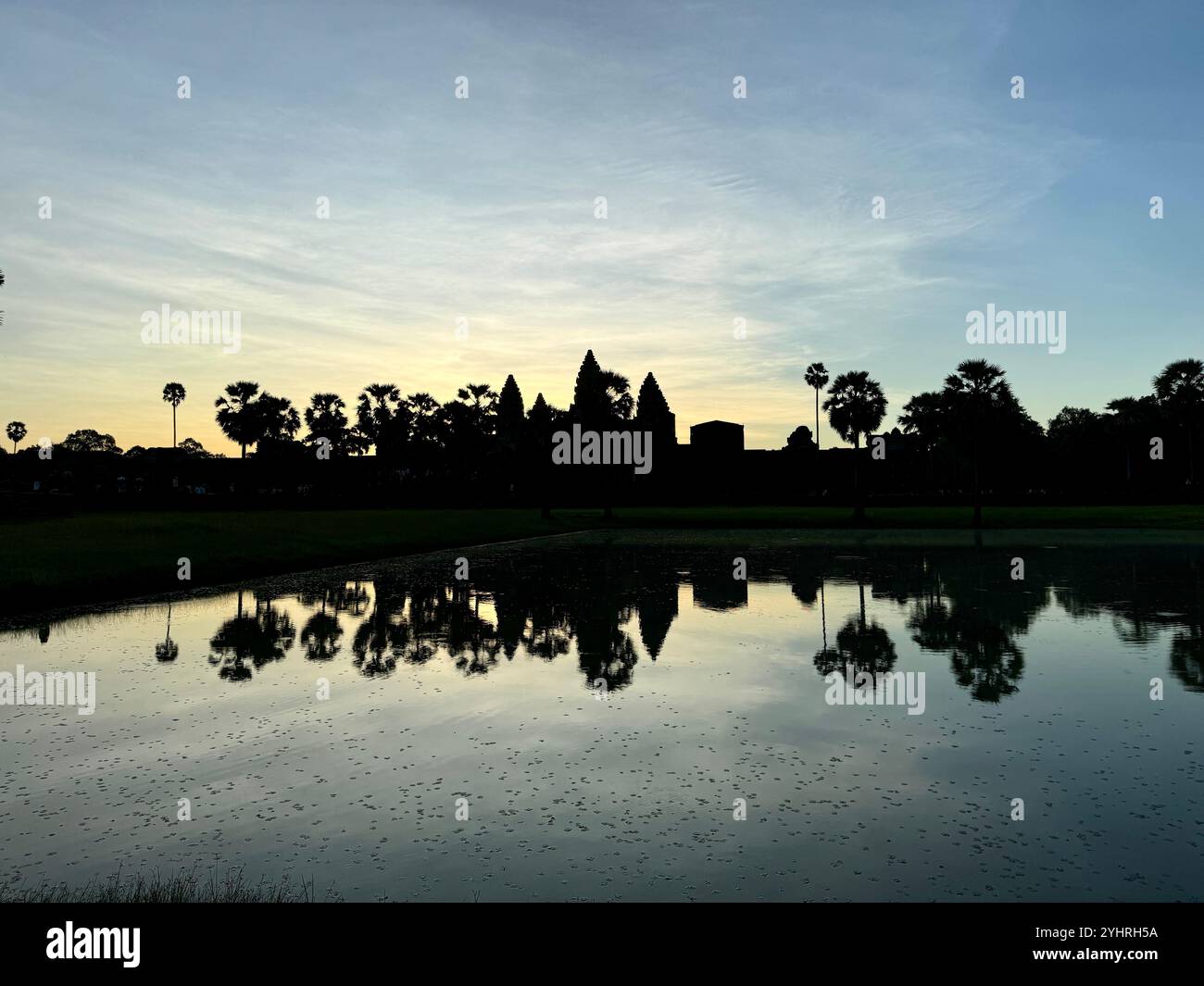 Sunrise at Angkor Wat  - a hindu & buddhist temple , located within the ancient Khmer capital city , Unesco world heritage site, Siem Reap , Cambodia - Smartphone Captured Stock Image