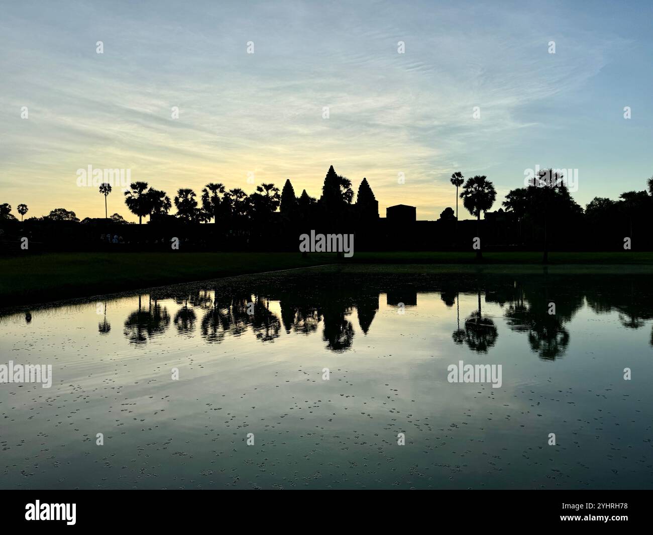 Sunrise at Angkor Wat  - a hindu & buddhist temple , located within the ancient Khmer capital city , Unesco world heritage site, Siem Reap , Cambodia - Smartphone Captured Stock Image