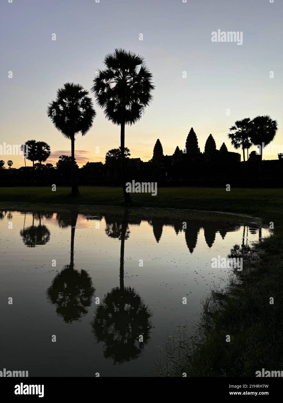 Sunrise at Angkor Wat  - a hindu & buddhist temple , located within the ancient Khmer capital city , Unesco world heritage site, Siem Reap , Cambodia - Smartphone Captured Stock Image