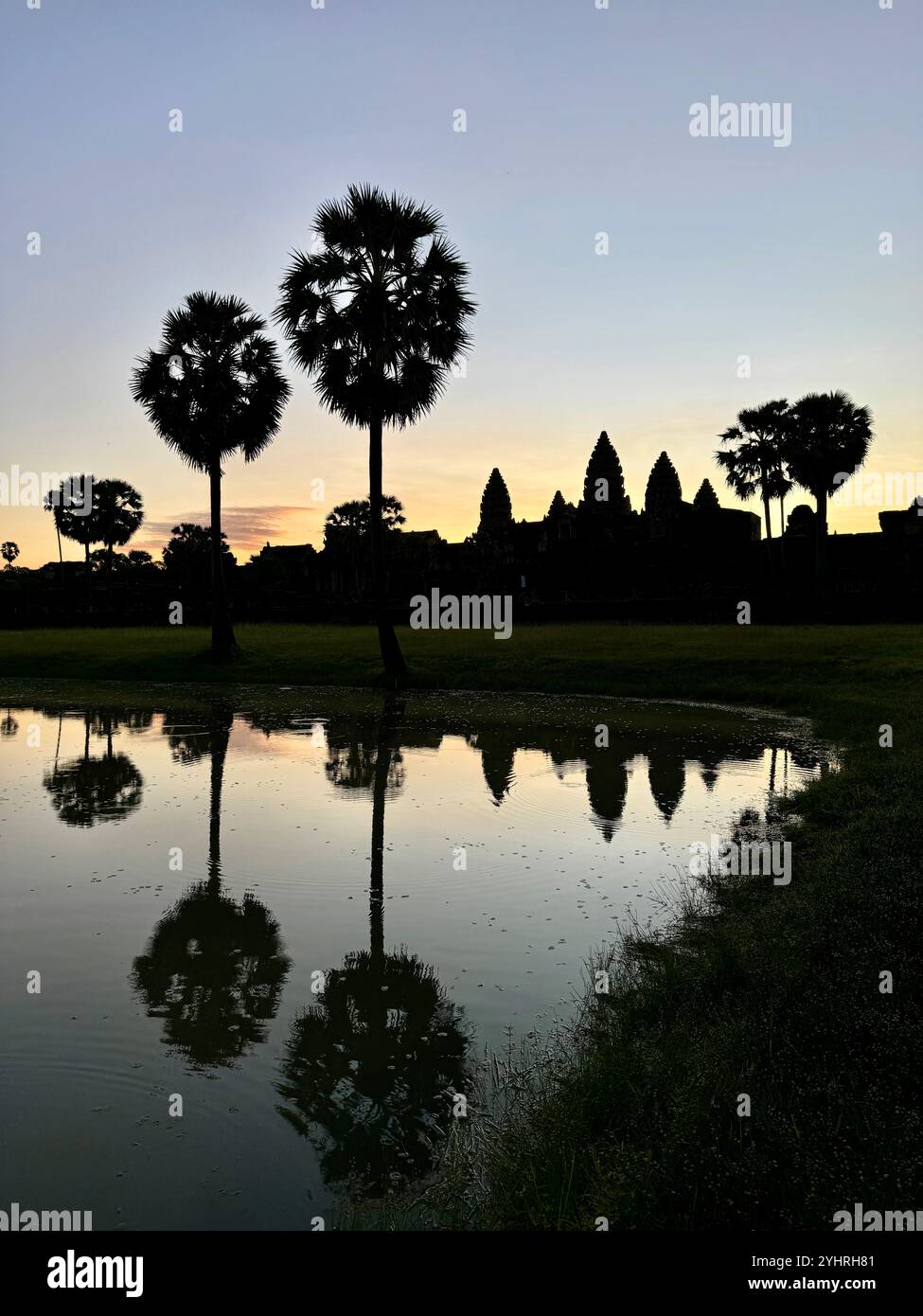Sunrise at Angkor Wat  - a hindu & buddhist temple , located within the ancient Khmer capital city , Unesco world heritage site, Siem Reap , Cambodia - Smartphone Captured Stock Image