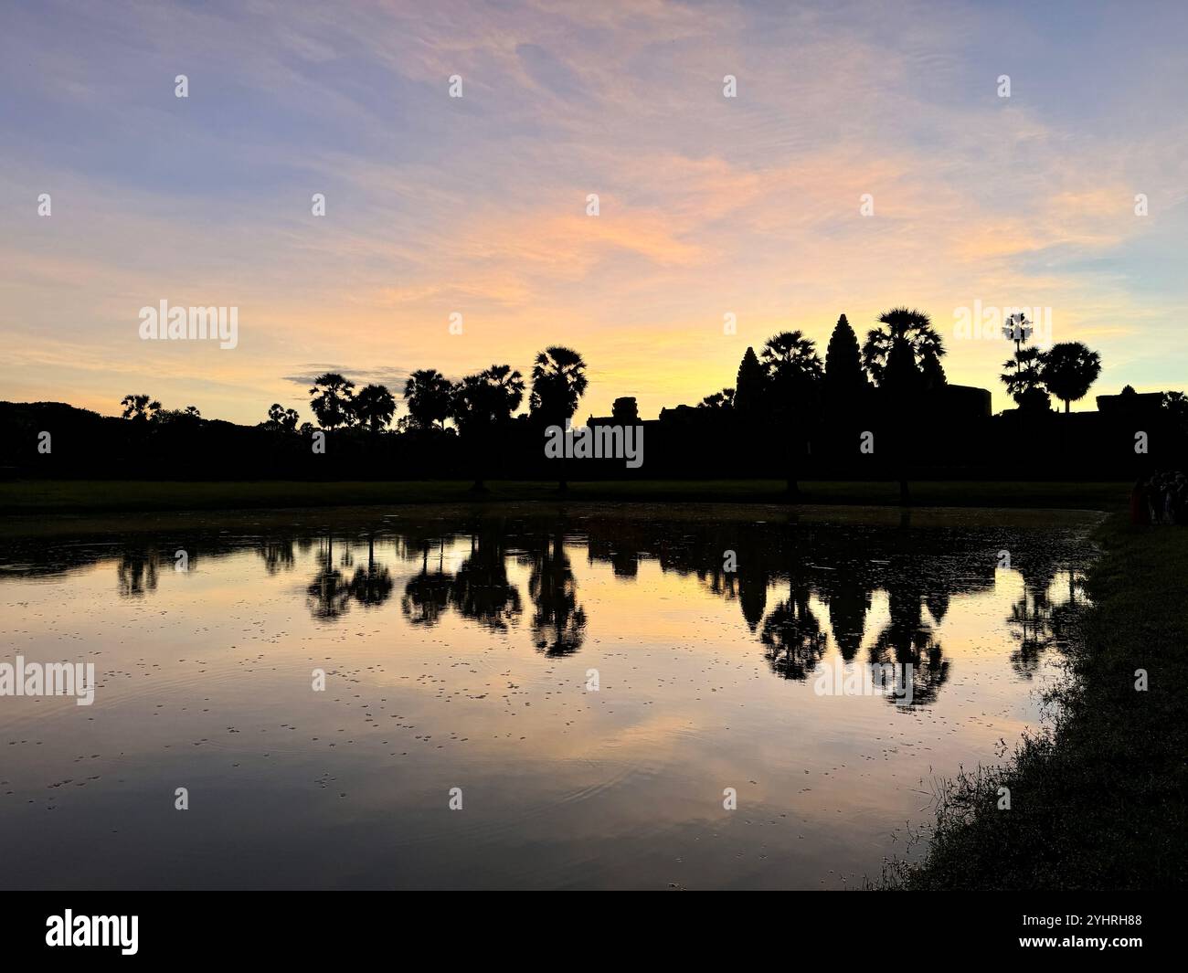 Sunrise at Angkor Wat  - a hindu & buddhist temple , located within the ancient Khmer capital city , Unesco world heritage site, Siem Reap , Cambodia - Smartphone Captured Stock Image