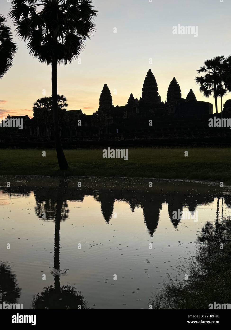 Sunrise at Angkor Wat  - a hindu & buddhist temple , located within the ancient Khmer capital city , Unesco world heritage site, Siem Reap , Cambodia - Smartphone Captured Stock Image