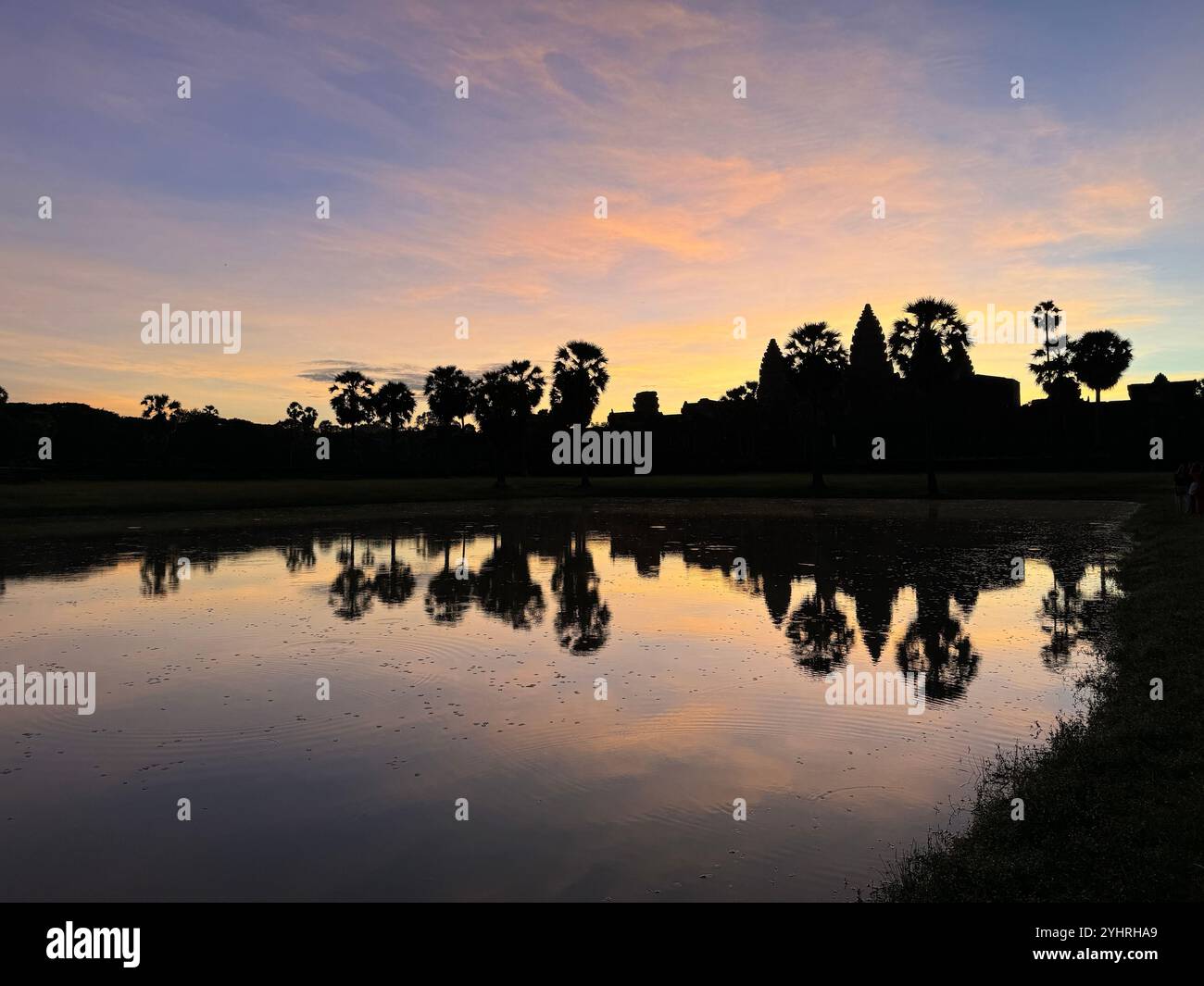 Sunrise at Angkor Wat  - a hindu & buddhist temple , located within the ancient Khmer capital city , Unesco world heritage site, Siem Reap , Cambodia - Smartphone Captured Stock Image
