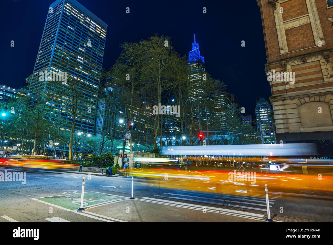 Night view of New York City street with illuminated skyscrapers, light ...