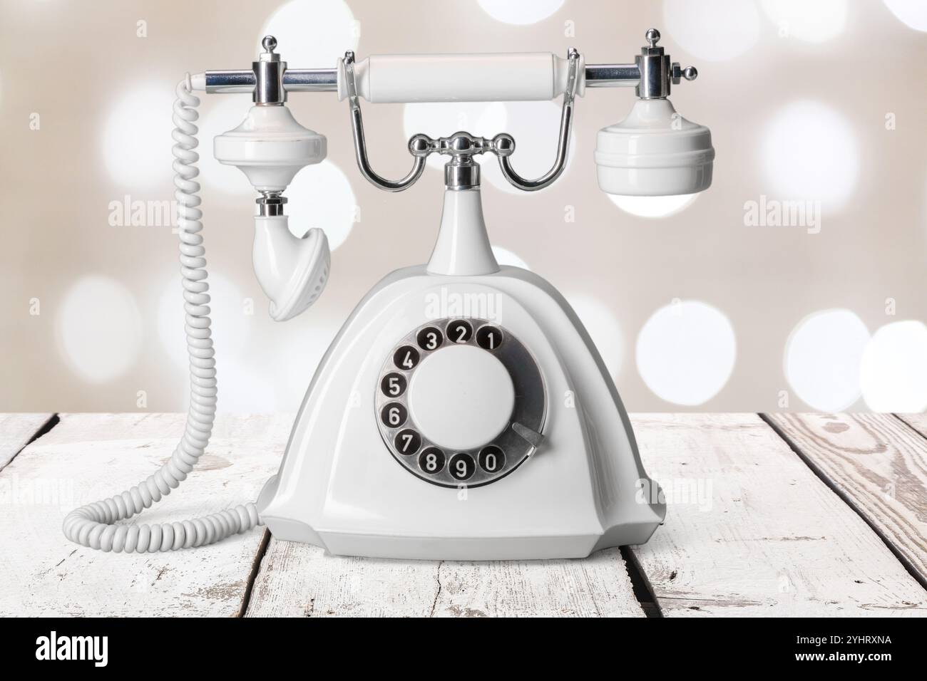 Vintage phone on a wooden table Stock Photo