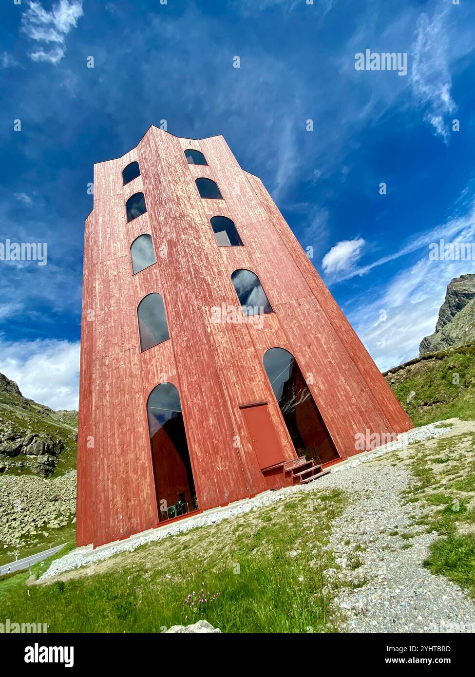 Modern Wooden Tower of Origen Theater Against a Bright Blue Sky - Smartphone Captured Stock Image