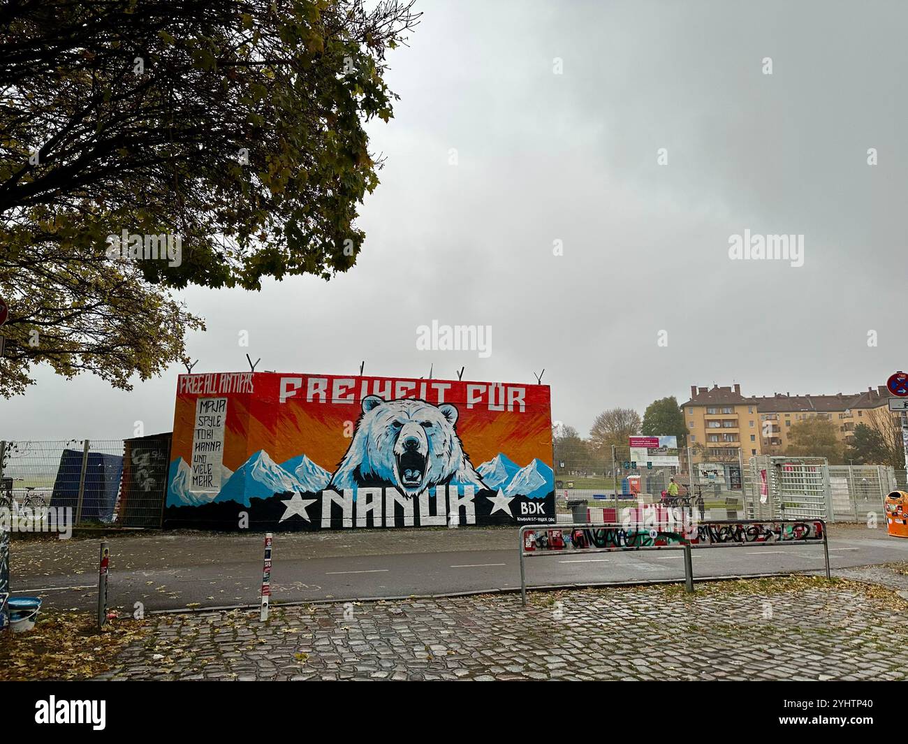 A graffiti demanding 'Freiheit für Nanuk' ('Free Nanuk') on a building next to Tempelhof airport, Berlin, Germany - Smartphone Captured Stock Image
