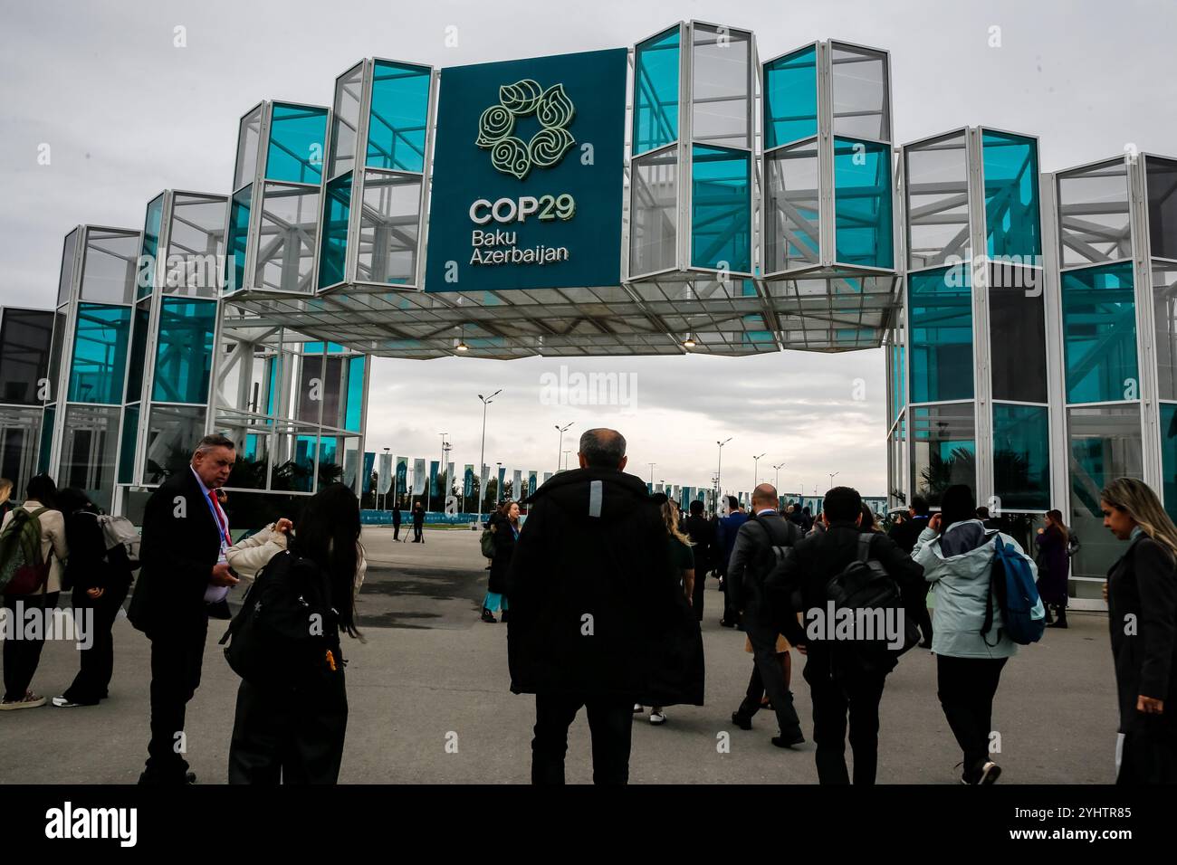 Cop29 Baku, Azerbaijan. 12th Nov, 2024. Participants walk by an entrance of ...