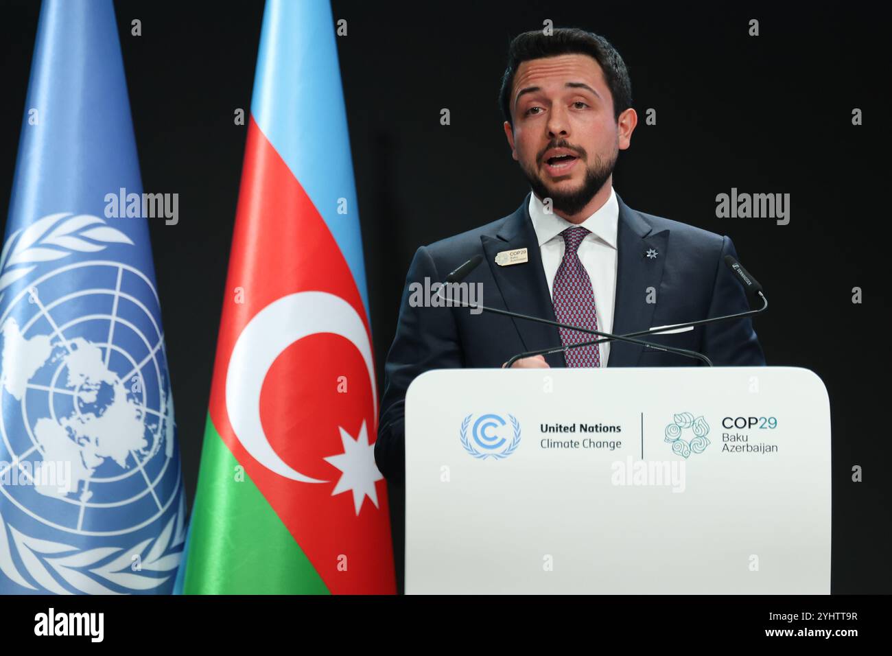 Baku, Azerbaijan. 12th Nov, 2024. His Royal Highness Al Hussein bin Abdullah II, Crown Prince of Jordan speaks during First Part of the High-Level Segment of United Nations Climate Change Conference in Nizami Plenary Room during COP29, an event held by UNFCCC in Baku Olympic Stadium. COP29, running from November 11-22 focuses on carbon offset clean energy finding. Credit: SOPA Images Limited/Alamy Live News Stock Photo