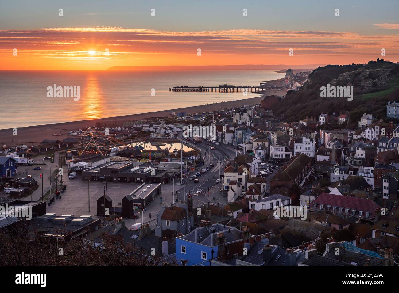 Sunset over Hastings old town from the top of east Hill east Sussex south east England UK Stock Photo