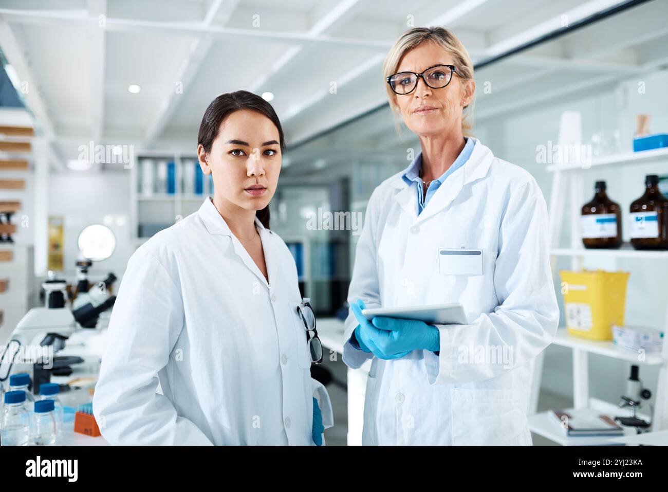 Women, scientist and together for portrait in lab with tablet, partner ...