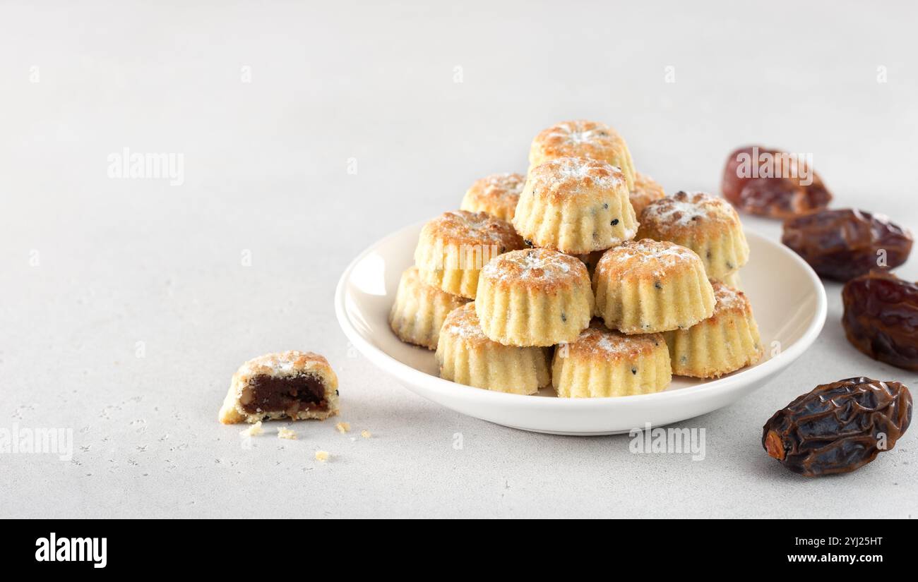 Arabic oriental cookies dates maamoul eid al fitr on a white background. Copy space. Stock Photo