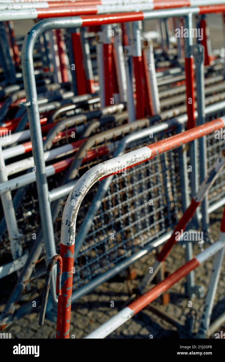 Stack metal barriers peeling red white paint hi-res stock photography ...