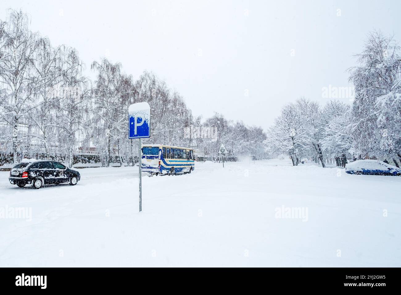 Road sign indicating parking. Parking road sign on a snowy street ...