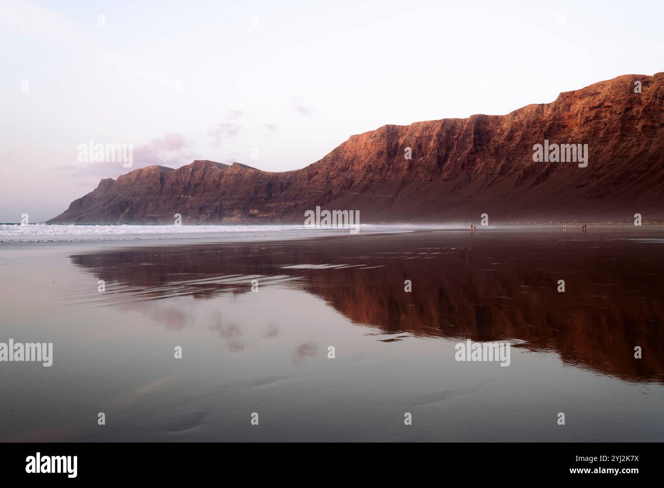 panoramic view of beach under mountains and cliff Stock Photo - Alamy