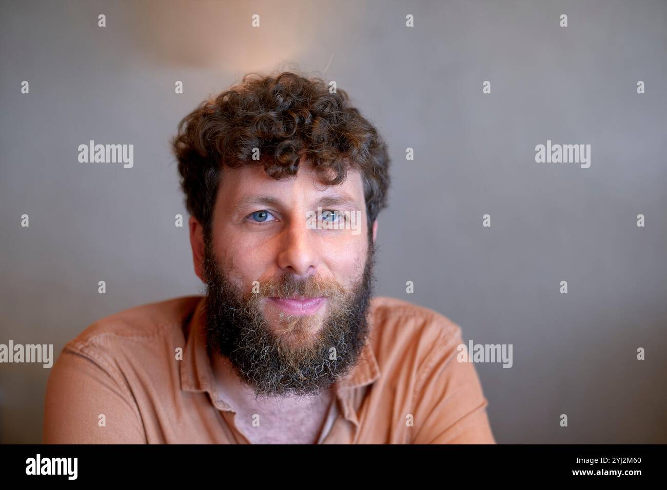 Bearded man with curly hair hi-res stock photography and images - Alamy