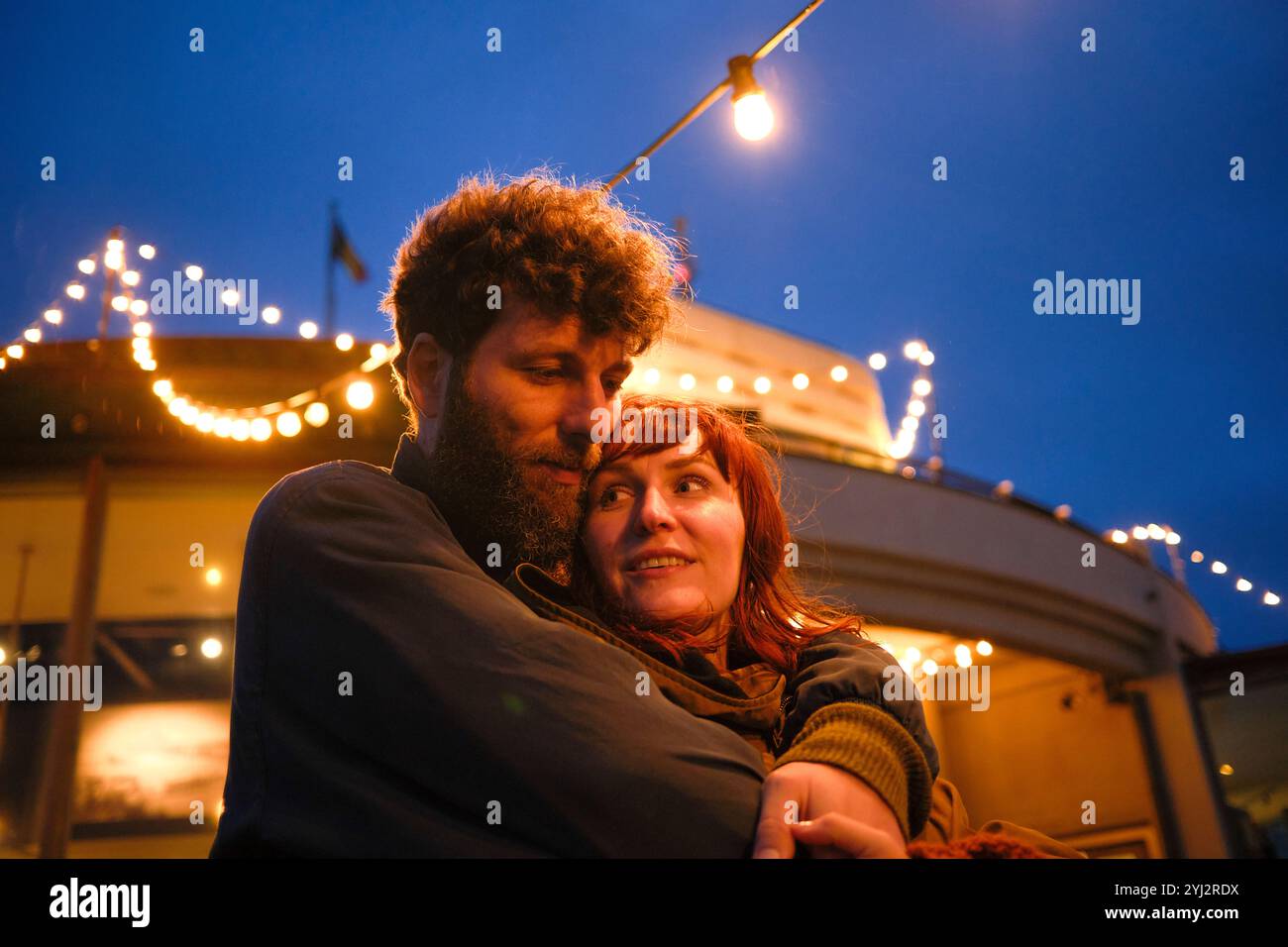 Joyful couple embraces under hi-res stock photography and images - Alamy