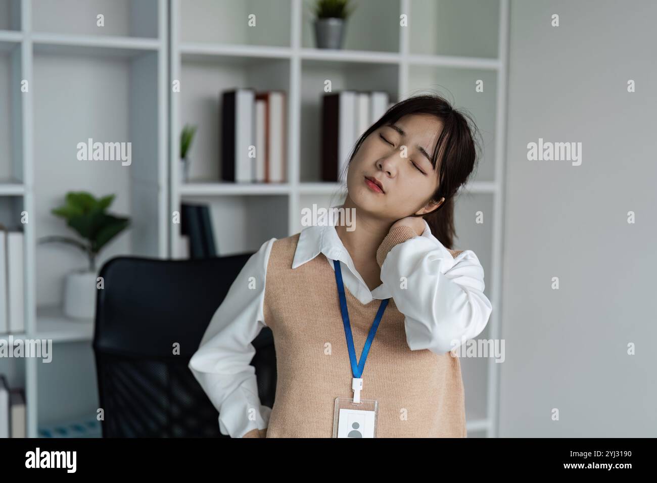 Young Professional Experiencing Office Syndrome with Neck Pain in ...