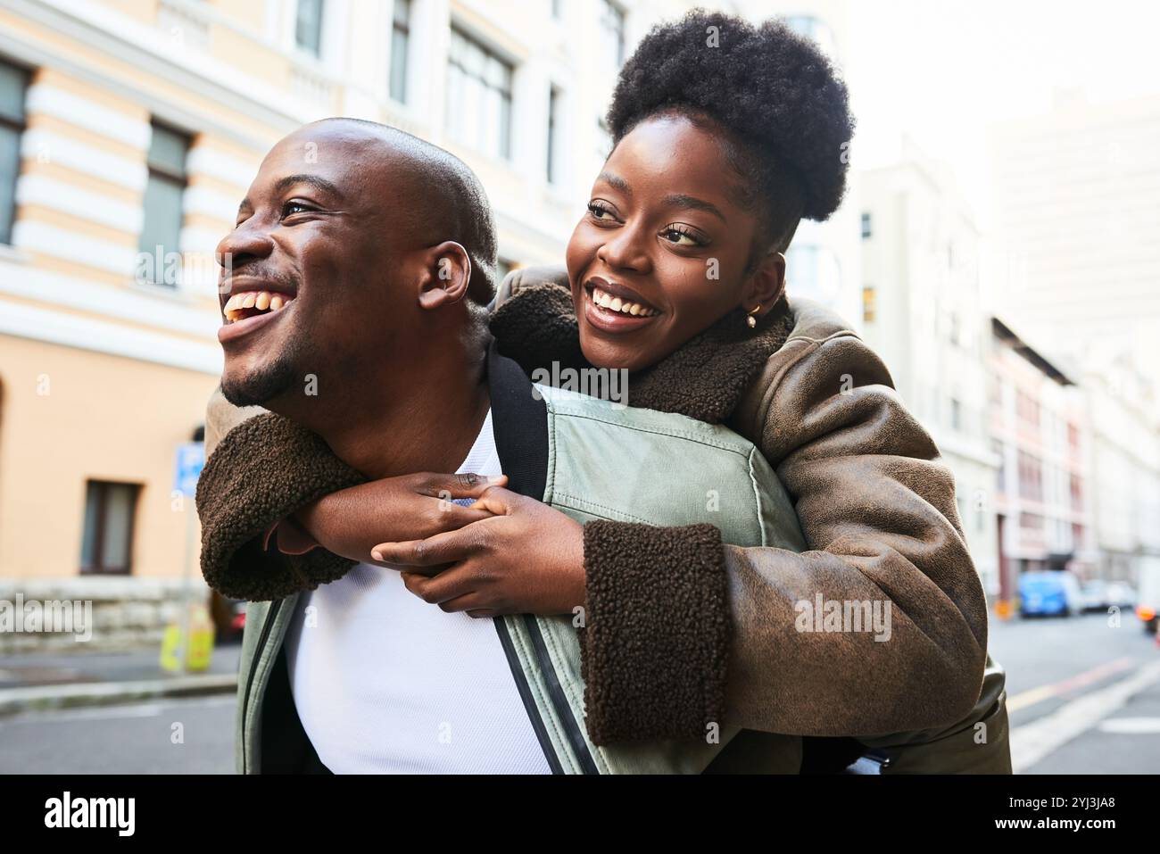 Joyful Couple Enjoying a Piggyback Ride in the City Streets on a Bright ...