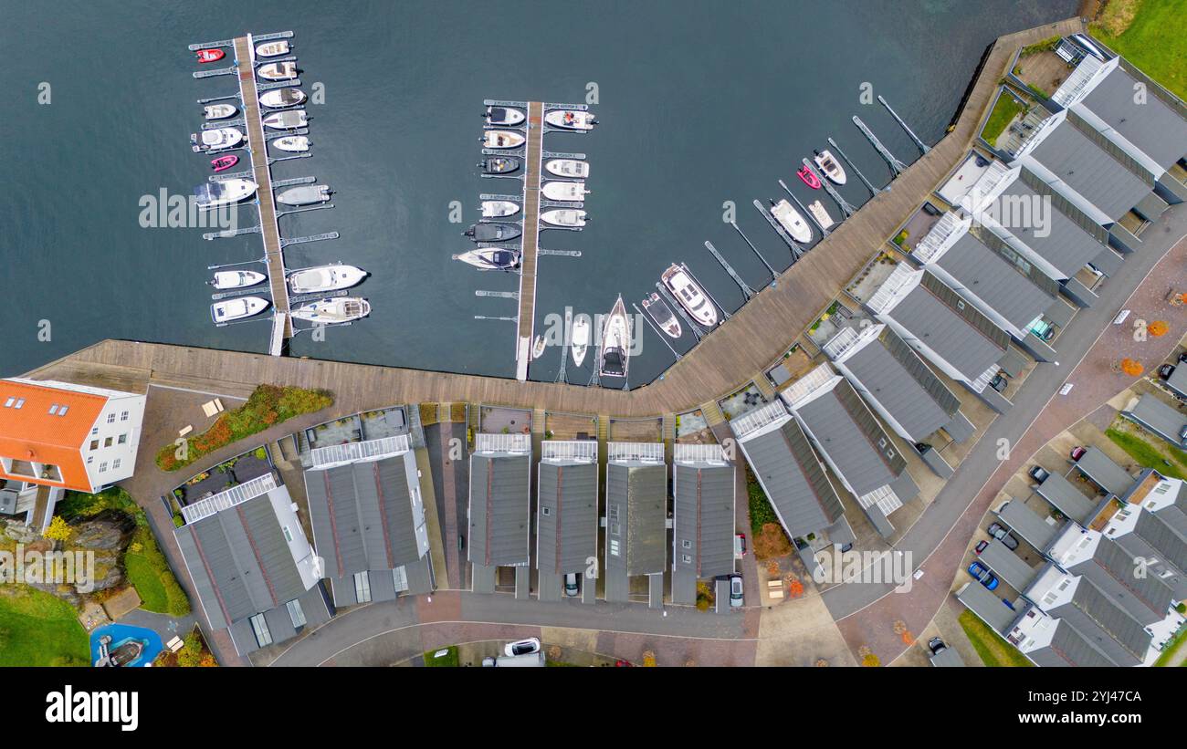 Aerial view of a marina with boats docked at piers and adjacent ...