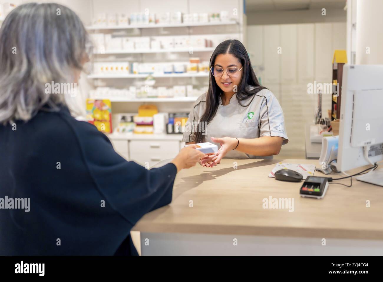 Old woman shopping in pharmacy hi-res stock photography and images - Alamy