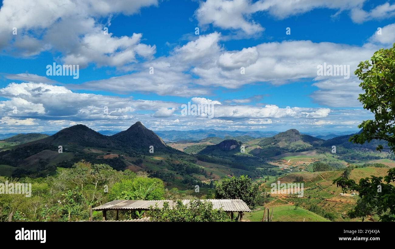 A breathtaking panoramic view of a mountainous landscape in Pedra Dourada, Minas Gerais, Brazil. - Smartphone Captured Stock Image