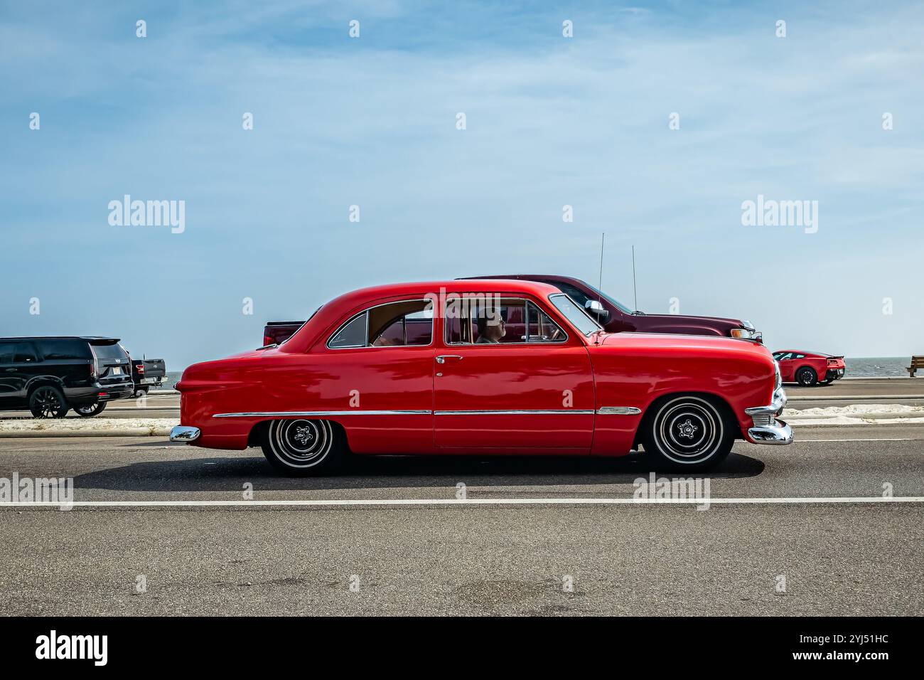 Gulfport, MS - October 04, 2023: Wide angle side view of a 1950 Ford Custom Deluxe Tudor Sedan at a local car show. Stock Photo