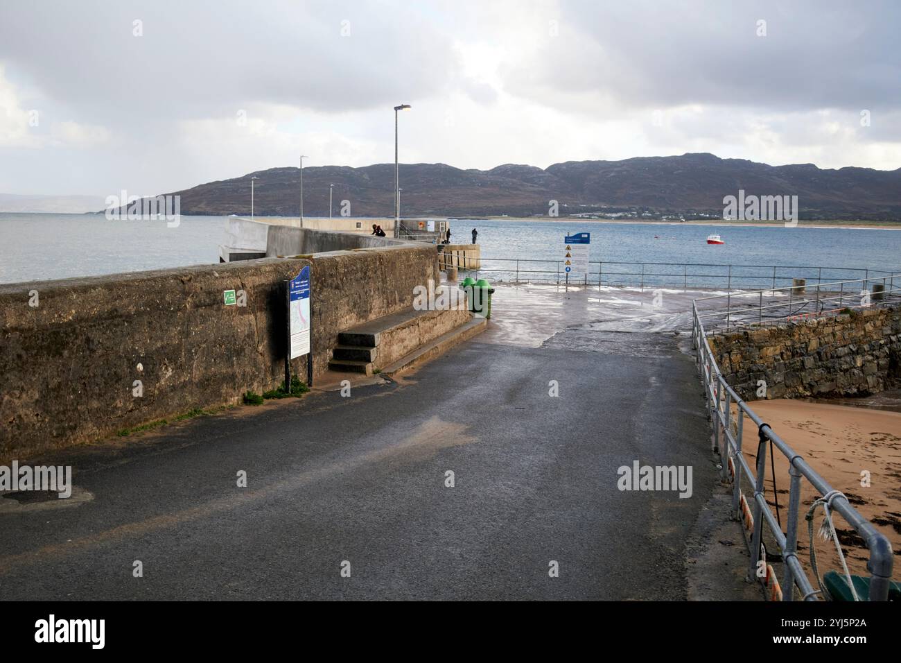 road down to portsalon pier, county donegal, republic of ireland Stock Photo