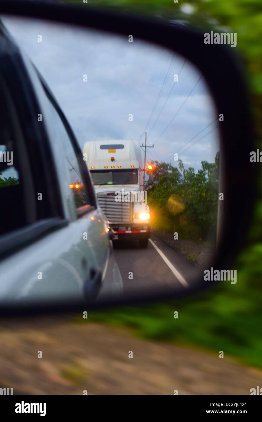 Big truck seen behind a car through rearview mirror, Costa Rica Stock ...